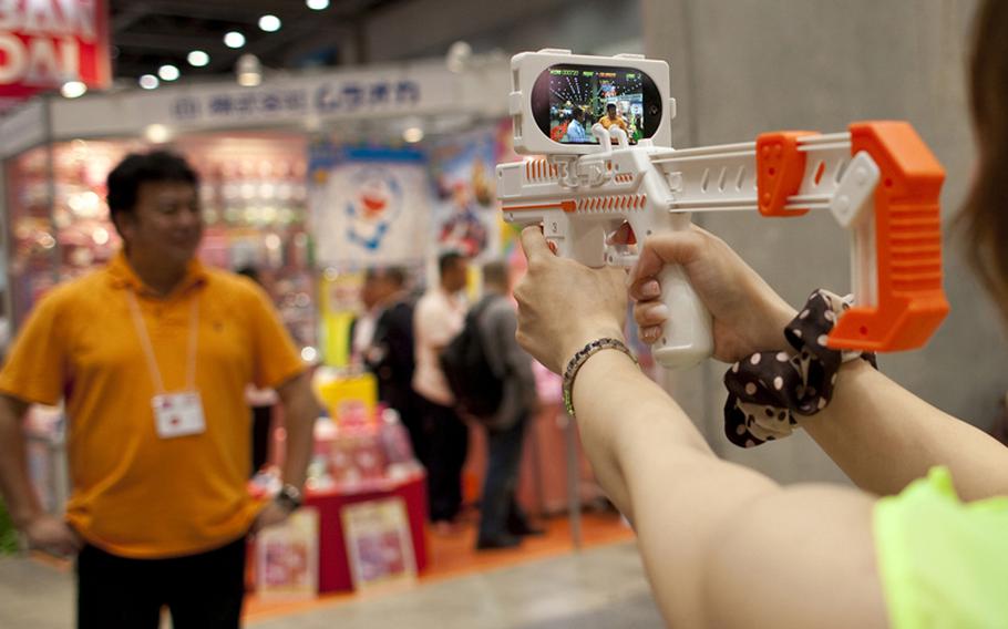 This augmented reality toy gun — WIZ inc. appBlaster — uses your iPhone’s or iPod Touch’s ability to take video and turns it into a monster zapping game. Download the application, set your device on the gun, and play. Set to be released in September, it will cost about $35.