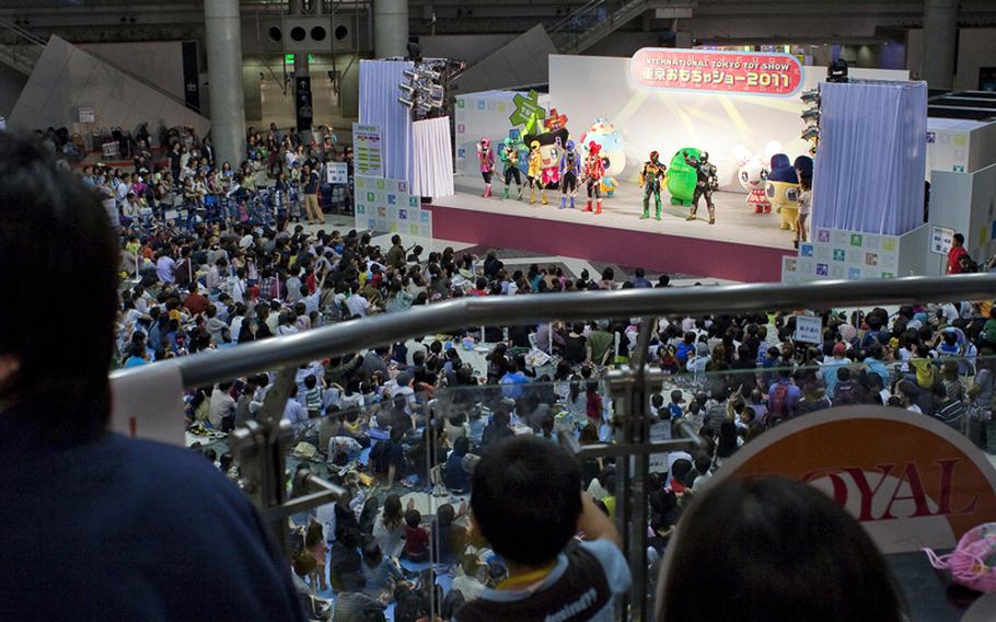 Thousands watch the Power Rangers perform at the Tokyo International Toy Show.