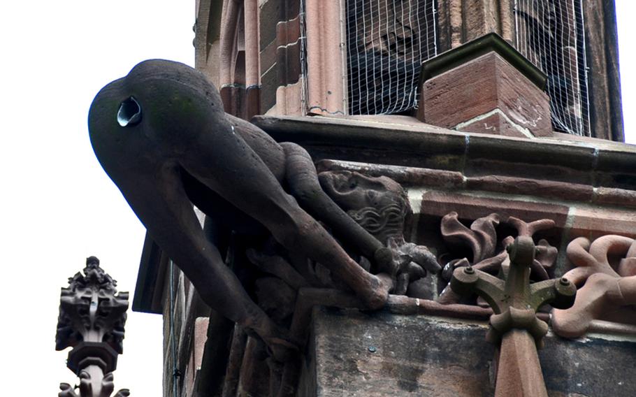 An amusing detail of the cathedral is this bare-bottom human water spout, which, according to legend, was meant to be a slap in the face to Catholic Church leaders at the time the steeple was built.