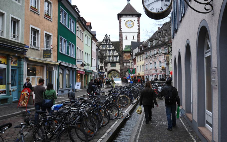 Only pedestrians and cyclists are allowed in Freiburg's old town. Narrow canals crisscross the center of the city, adding even more charm to centuries-old buildings. Freiburg's oldest medieval gate, the Schwabentor, is in the background.