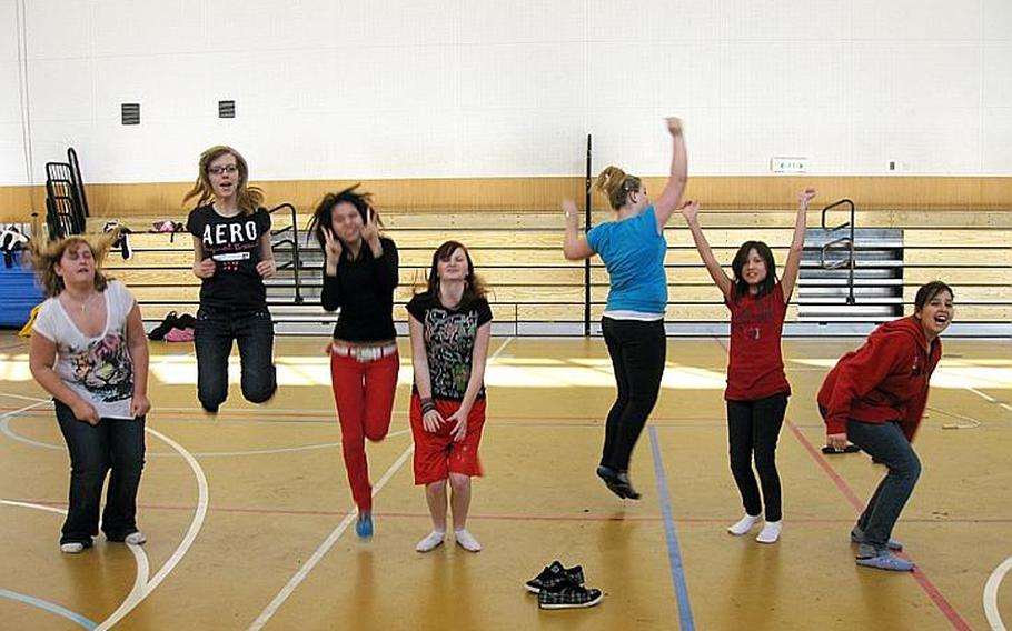 From left: Courtney Leiker, Teresa Talley, Riko Koreen, Paige Hicks, Taylor Michael, Raimu Hinkamper and Rosalinda Vandyke have some fun in the gym at Yokota Middle School this year while participating in 'Girls Having Fun.'