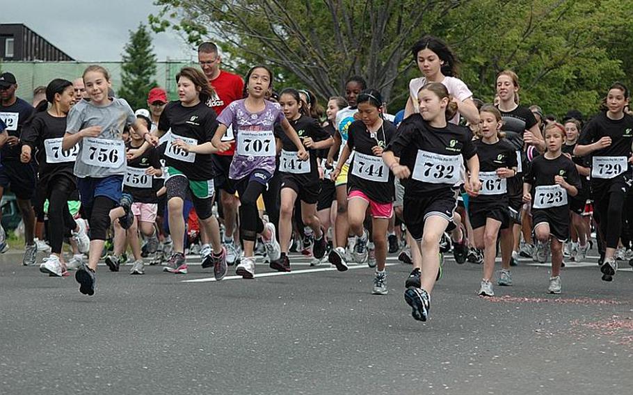 Members of the 'Go Girls Go' club -- in the black shirts -- start a 5k race on May 21 at Misawa Air Base, Japan.