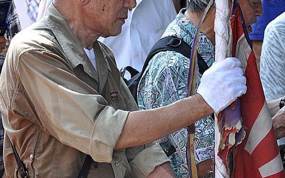 People wore military uniforms and sang traditional battle songs to honor those enshrined at Yasukuni. One of the songs they sang was "Muntinlupa no yowa fukete," which translates to "Night dawns on Muntinlupa,"? a city in the Philippines.