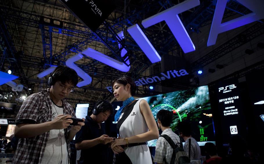 Many waited in long lines to try out Sony&#39;s new PlayStation Vita Saturday at the Tokyo Game Show 2011.