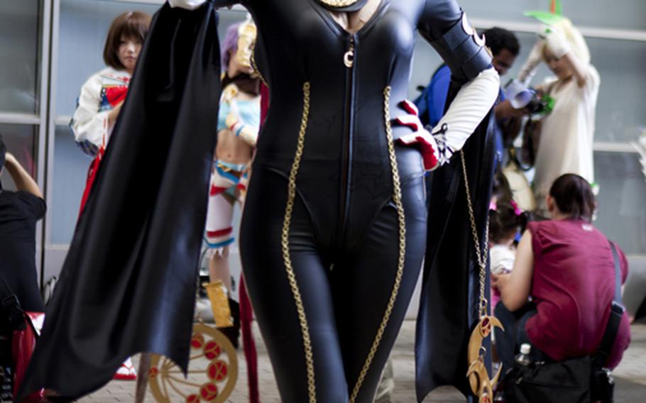 A cosplayer dressed as the popular video game vixen Bayonetta was one of the many elaborately dressed, Saturday at this year's Tokyo Game Show.