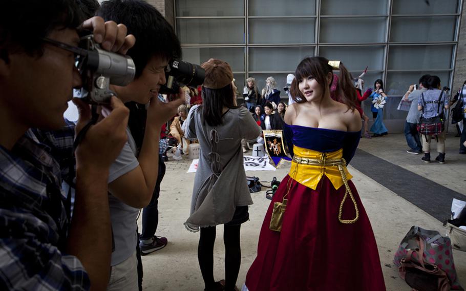 Videogames weren't the only thing on display as huge crowds came to see the many scantly clad "cosplayers"? who provided a side attraction at Saturday&#39;s Tokyo Game Show at Chiba Prefecture&#39;s Makuhari Messe convention center.