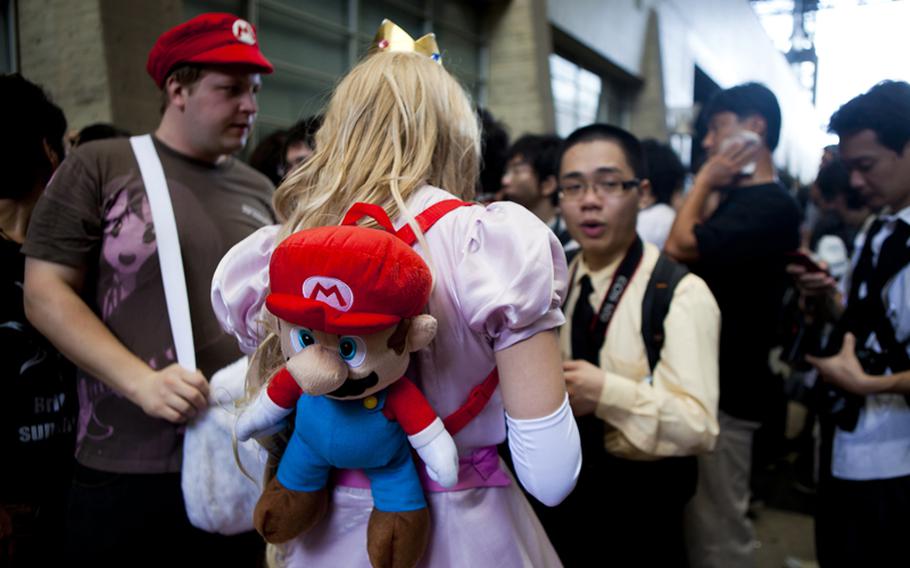 Elaborately dressed cosplayers attracted attention at the Tokyo Game Show.