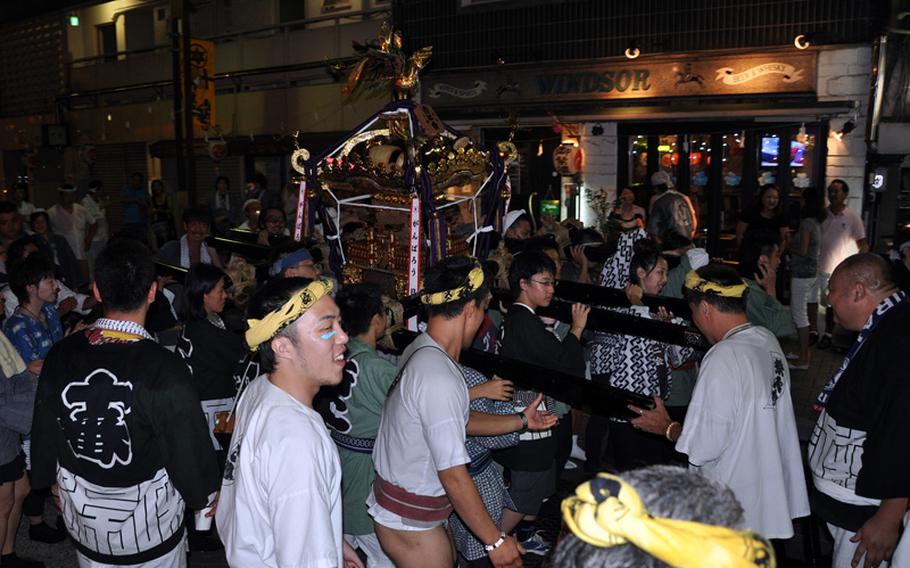 Festival participants switched places from time to time so everyone got a chance to carry the shrine and to give others a break.