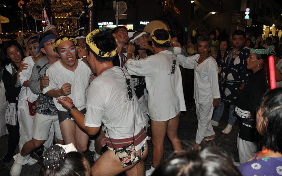 Pants are optional, apparently. At least the pantless participants wear fundoshi, traditional Japanese underwear.