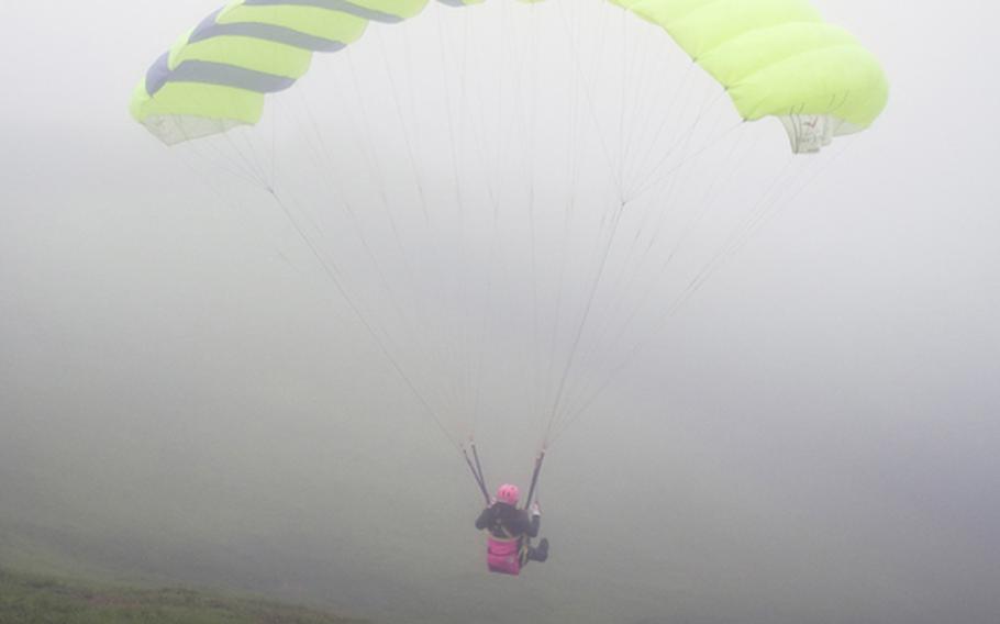 My friend Kanako Kobayashi first flight is a success as she  glides down on her first paragliding experience in Izu this past August.