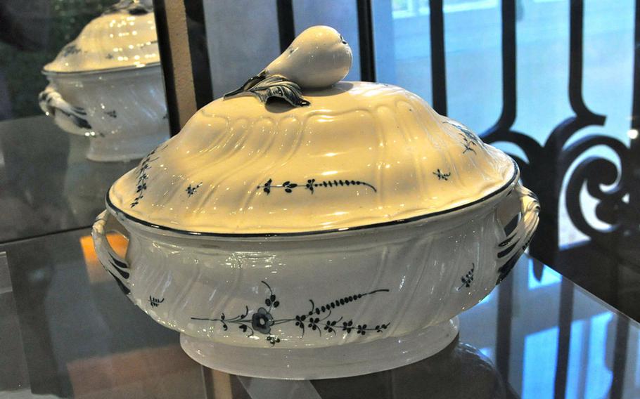 The museum's earliest pieces, including this original by Pierre Joseph Boch, whose porcelain cookery from 1770 features an indigo-and-white flower pattern still used by the company today.