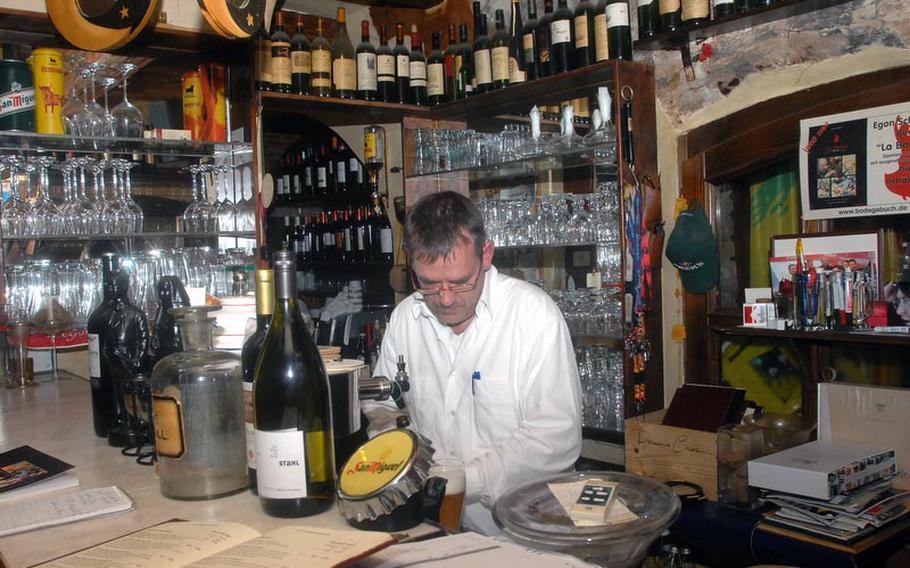 Stephan Argauer works behind the bar at La Bodega, a Spanish tapas bar in Weiden, Germany, a 20-minute drive from the Grafenwoehr Training Area.
