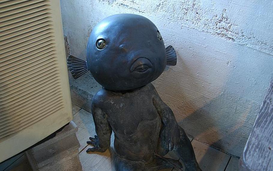One of the many sculptures that decorate an art gallery and shop in the old Kozan Touen pottery factory compound and gardens in downtown Hasami.