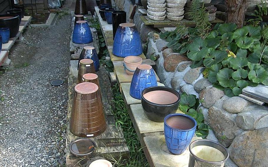 Finished pieces of pottery and their price tags await new owners at the old Kozan Touen pottery factory compound and gardens in downtown Hasami.