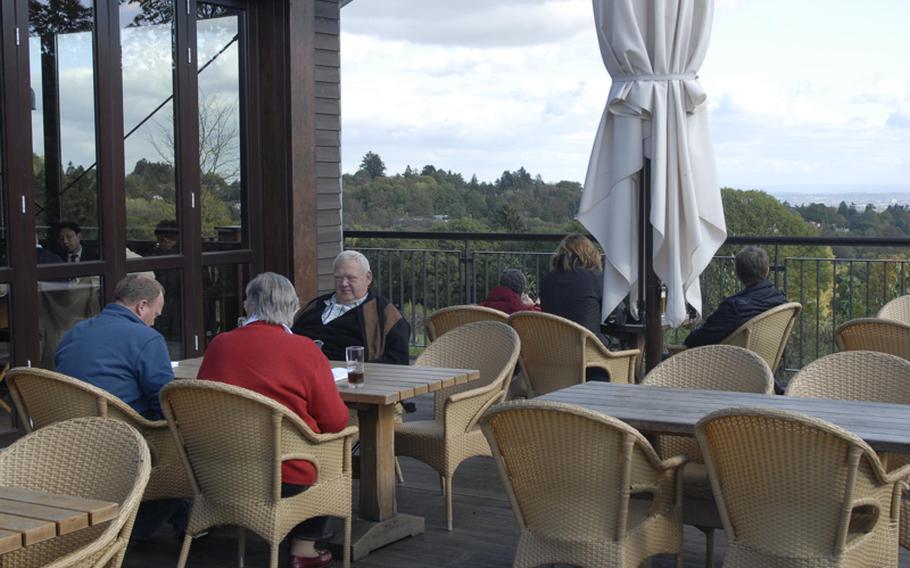 Guests enjoy a recent sunny autumn afternoonon Lodge's outdoor patio. The patio overlooks an area housing exotic animals belonging to the Opel Zoo.