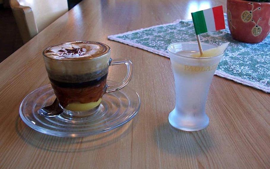 Calimero, a layered hot drink of egg liqueur, espresso and foamed milk dusted with cocoa served in a glass cup  is a good top-off after a day at slopes around Rifugio Piz Arlara on the east side of Corvara, Italy.