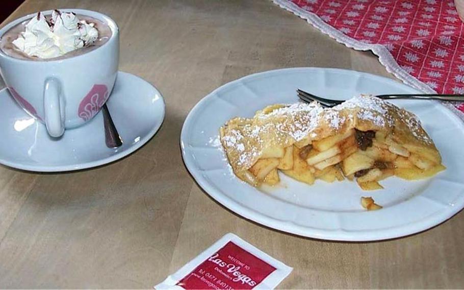 Hot Chocolate and apple strudel Italian-style with pine nuts at Rifugio Las Vegas between Corvara and San Cassiano, Alta Badia, Italy. 