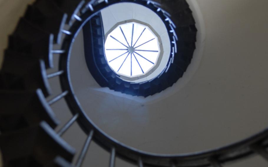 A staircase spirals toward the light in a tower at Burg Rheinstein.