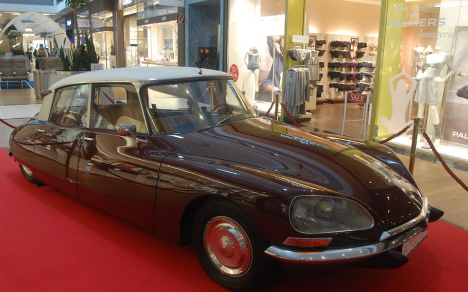 A 1967 Citroen is among several vintage cars on display in the Loop 5 Shopping Centre just outside of Darmstadt, Germany, and near Frankfurt Airport.