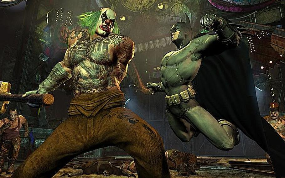 Batman takes a whack at one of the Joker's henchmen in 'Batman: Arkham City.'