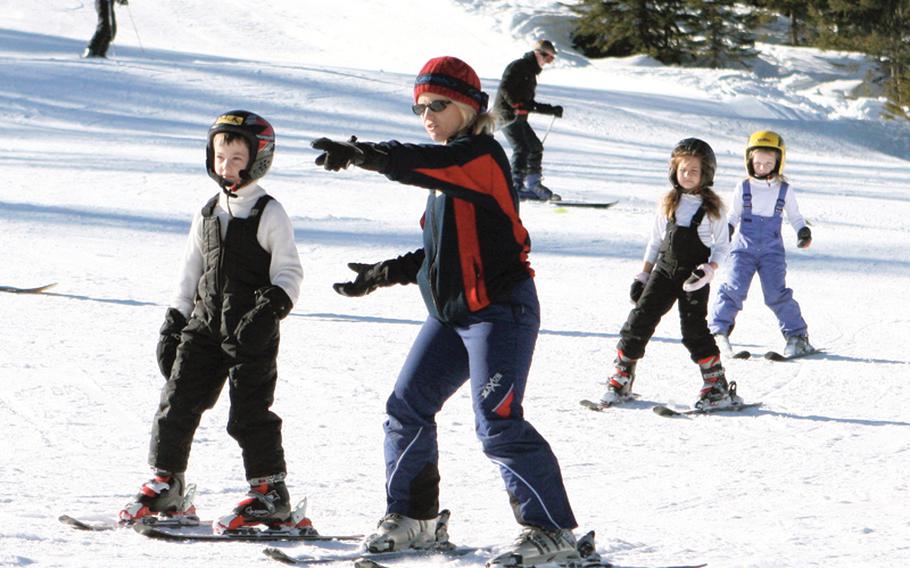 An instructor at the Edelweiss Lodge and Resort points the way for her group of young skiers. The resort has a special program for children called Just For Kids that lets them learn the basics on a gentle slope.