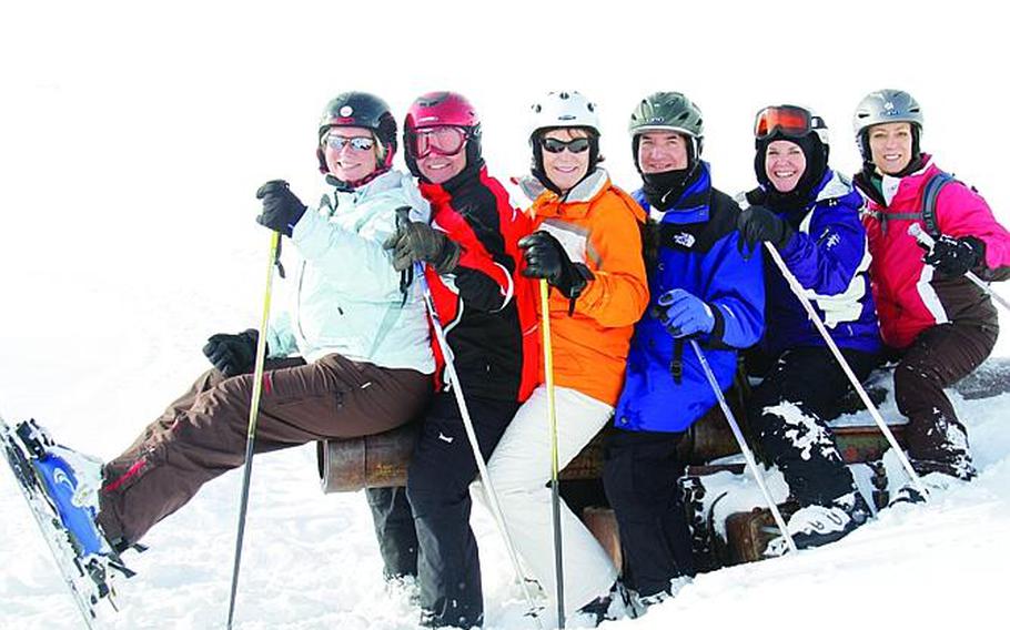 Heidelberg International Ski Club members members strike a pose while sitting on a WWII cannon during a trip to the Dolomites near Arabba, Italy.