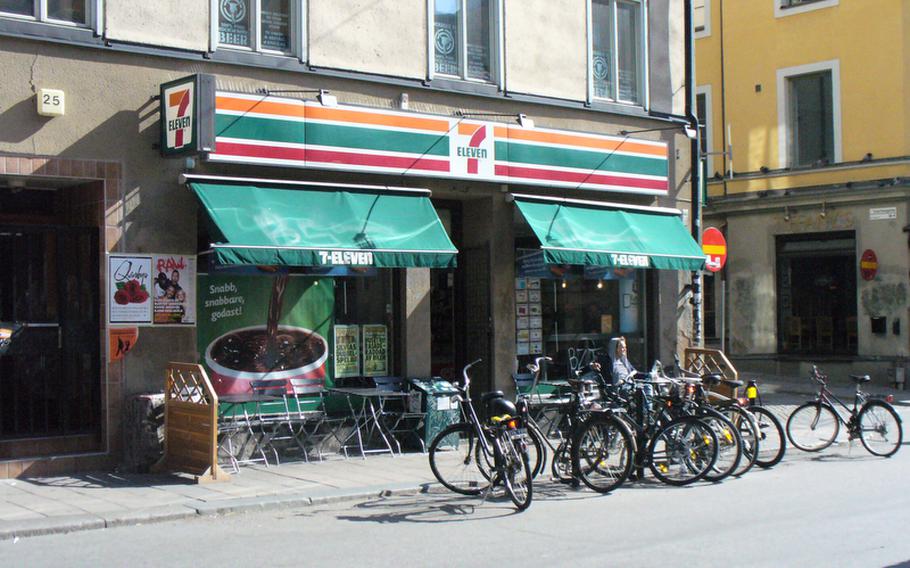 A patron at the 7-Eleven on Gotgatan 25, where Lisbeth Salander stocks up on groceries in the book and film "The Girl with the Dragon Tattoo," relaxes in the afternoon sun.