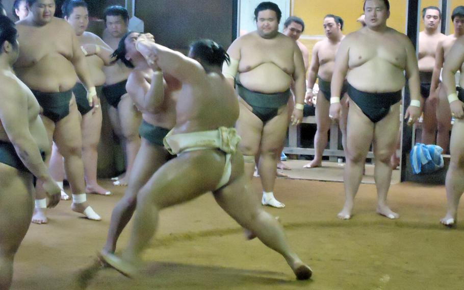 The art of sumo wrestling is part tradition and part brute force. Here, one sumo wrestler from the Sadogatake sumo stable in Fukuoka uses a shot to the face of another to get him out of the ring.