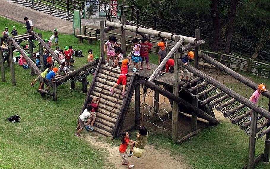 Children play on a climbing gym in Nago Castle Site Park. The park has one of the best kids play areas I have seen on Okinawa. There are rest room facilities and drink machines as well as picnic tables. 