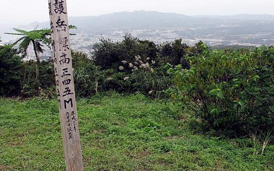 After just over an hour of hiking, the summit of Nago Mountain appeared with a wooden stake with Japanese writing inscribed on it. The small clearing offered beautiful views in nearly all directions.