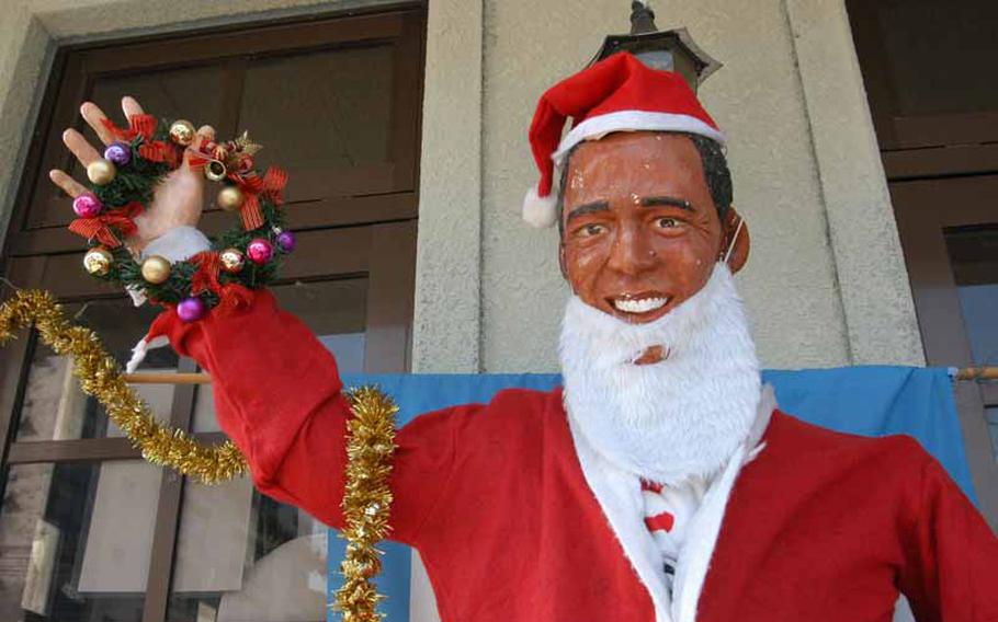 Dressed for the holidays, a life-size statue of President Barack Obama greets visitors to the tourist information center in Obama, Japan. The small town should not be confused with its bigger sister city up north, and sits at the base of the active volcano, Mount Unzen. 