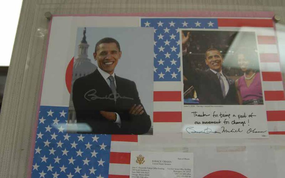 An autographed photo of the U.S. president, Barack Obama, and other souvenirs, hang in the tourist information center in Obama, Japan.