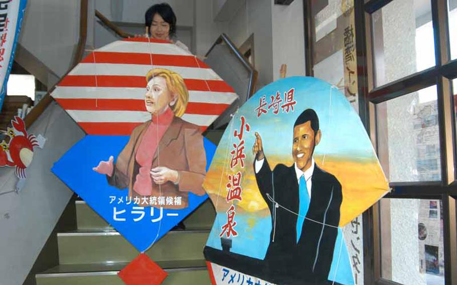 Kites depicting President Barack Obama and Secretary of State Hillary Rodham Clinton sit in the tourist information center in Obama, Japan.