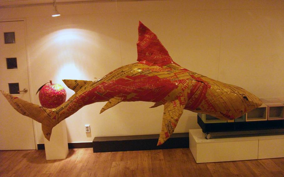 A shark hangs from the ceiling of the Jong IE Nara Paper Art Museum in Seoul.