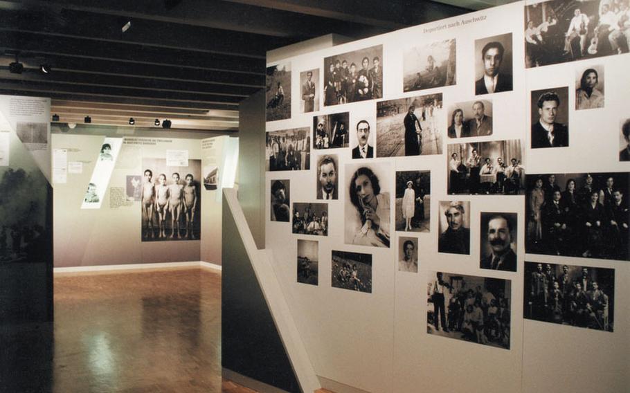 Among the exhibits at the Documentation and Cultural Centre of German Sinti and Roma in Heidelberg, Germany, is a wall of photos and list of names of the many thousands of Sinti and Roma who perished at the Auschwitz-Birkenau  death camp during the Third Reich.