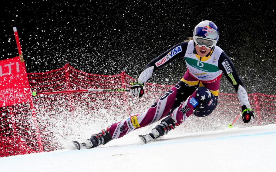 Snow flies as U.S. Ski Team member Lindsey Vonn races down the slopes at the World Cup competition in Garmisch-Partenkirchen, Germany, in 2011. Members of the U.S. women's team will visit Edelweiss Lodge and Resort in Garmisch to meet servicemembers and their families on Feb. 1.