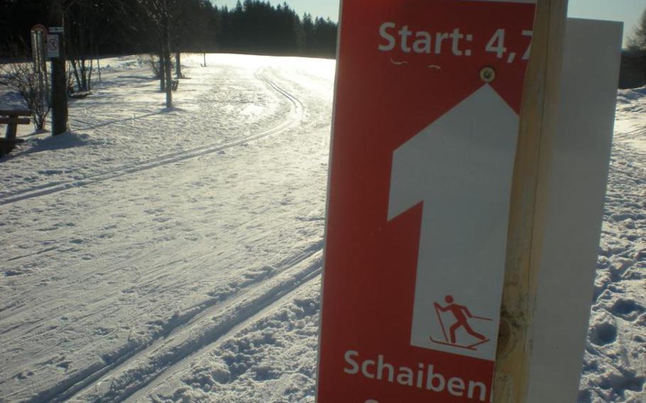 Near Schönwald, a town in the Ferienland region of Germany's Black Forest, the sign at the start of a cross country ski trail named Schaibenloipe is broken, but still gives enough information: This way to 4.7 kilometers of tracks.