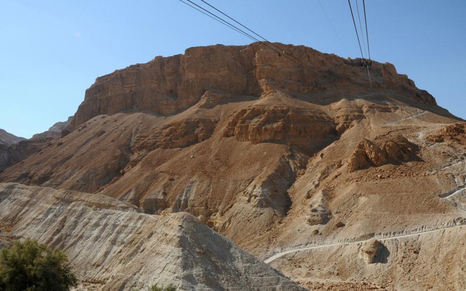 The fortress of Masada sits on the eastern edge of the Judean desert in Israel, near the Dead Sea. Visitors can take cable cars up to the top or trek up on the so-called Snake Path seen on the lower right.