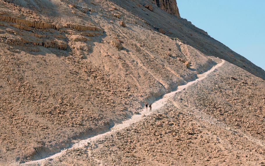 A couple of visitors stroll down the Snake Path that leads to the top of the fortress.