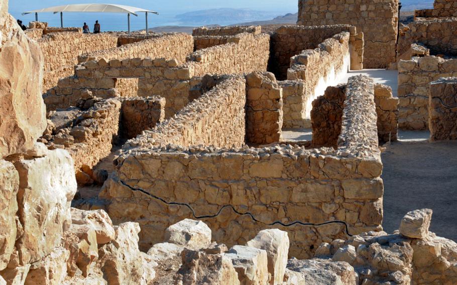 The remnants of storage rooms form a labyrinth of walls at Masada. The black line on the wall in the foreground indicates the border between the old and restored sections.