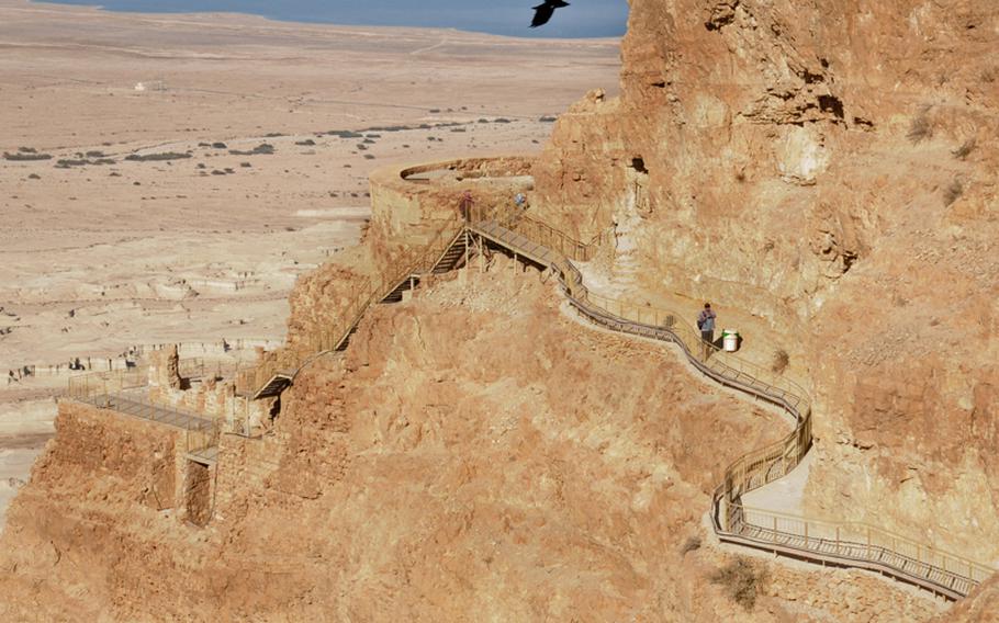 The Dead Sea is visible in the background, along with the remains of King Herod's North Palace at the edge of Masada.  