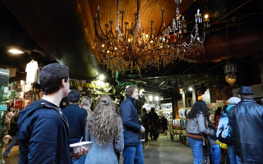 Beautiful chandeliers decorate some areas of the Camden Lock market. But turn the corner, and you might find Goth fashions dominating the decor.