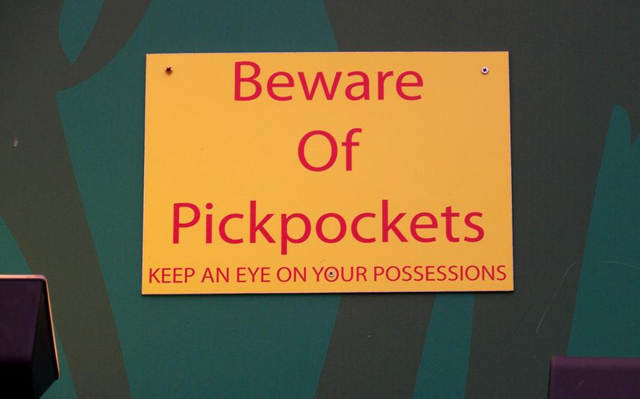 Watch for thieves who prey on distracted tourists in packed venues, especially market settings. This sign, posted near the Camden Lock High Street Market Hall, is a good reminder.