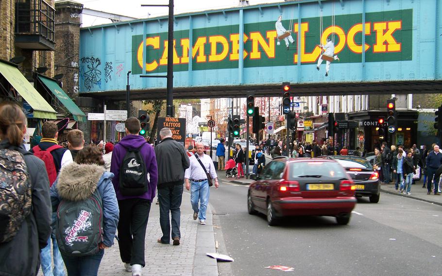 Pedestrians make their way along Camden Town's busy High Street to the Camden Lock market.