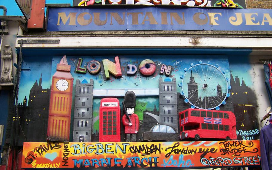 A colorful sign for a souvenir and clothing store on Camden Town's High Street.