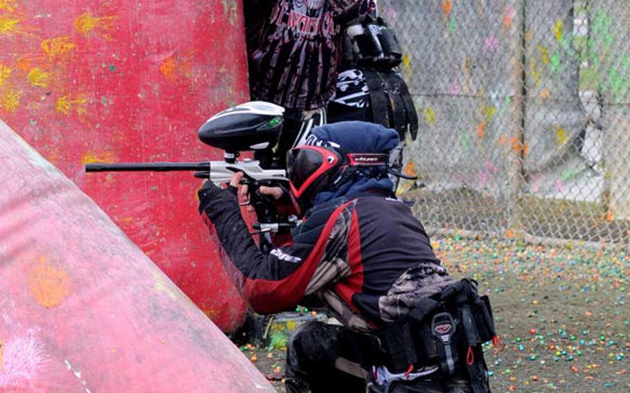 Ryukyu Kings players use  inflatable pylons to protect themselves during a game of paintball at the Kadena Air Base paintball field on Feb. 25, 2012.