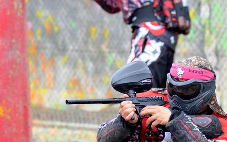 Players fire off paintball rounds at opponents while doing their best to stay as protected as possible from behind the inflatable pylons. Speedball paintball games take approximately two minutes to play and involve about five players on each team.
Matt Orr/Stars and Stripes
Feb. 25, 2012