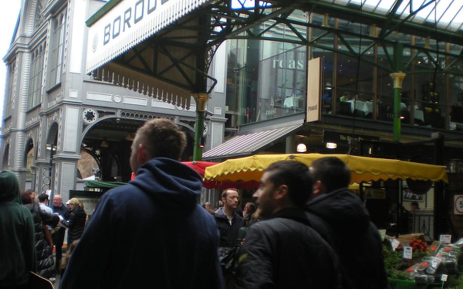 Crowds of London foodies converge on Borough Market near London Bridge for a tasty day out. The market's prevalent theme is "Food, glorious food."