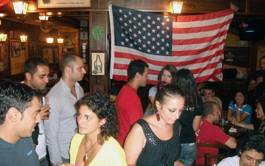 Packing an Irish pub at the port of Pozzuoli, Italy, every Wednesday is an ever-growing eclectic group of Brits, Americans and Italians who come together to socialize, play games and perhaps learn a few foreign language skills. They call themselves the British Community.
