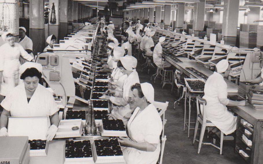 Employees busily package boxes of chocolates at Terry's chocolate factory in York 1966.